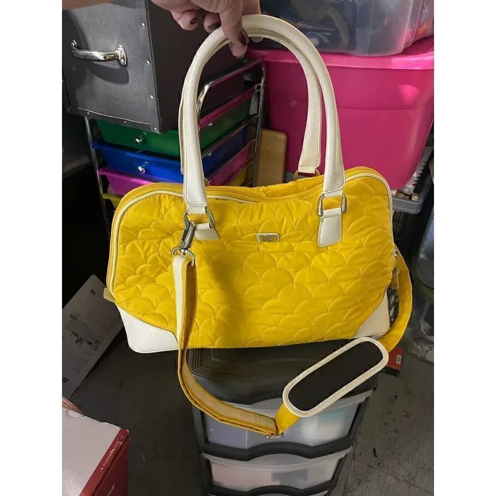 DVF quilted yellow padded weekender/rolling bag /luggage case